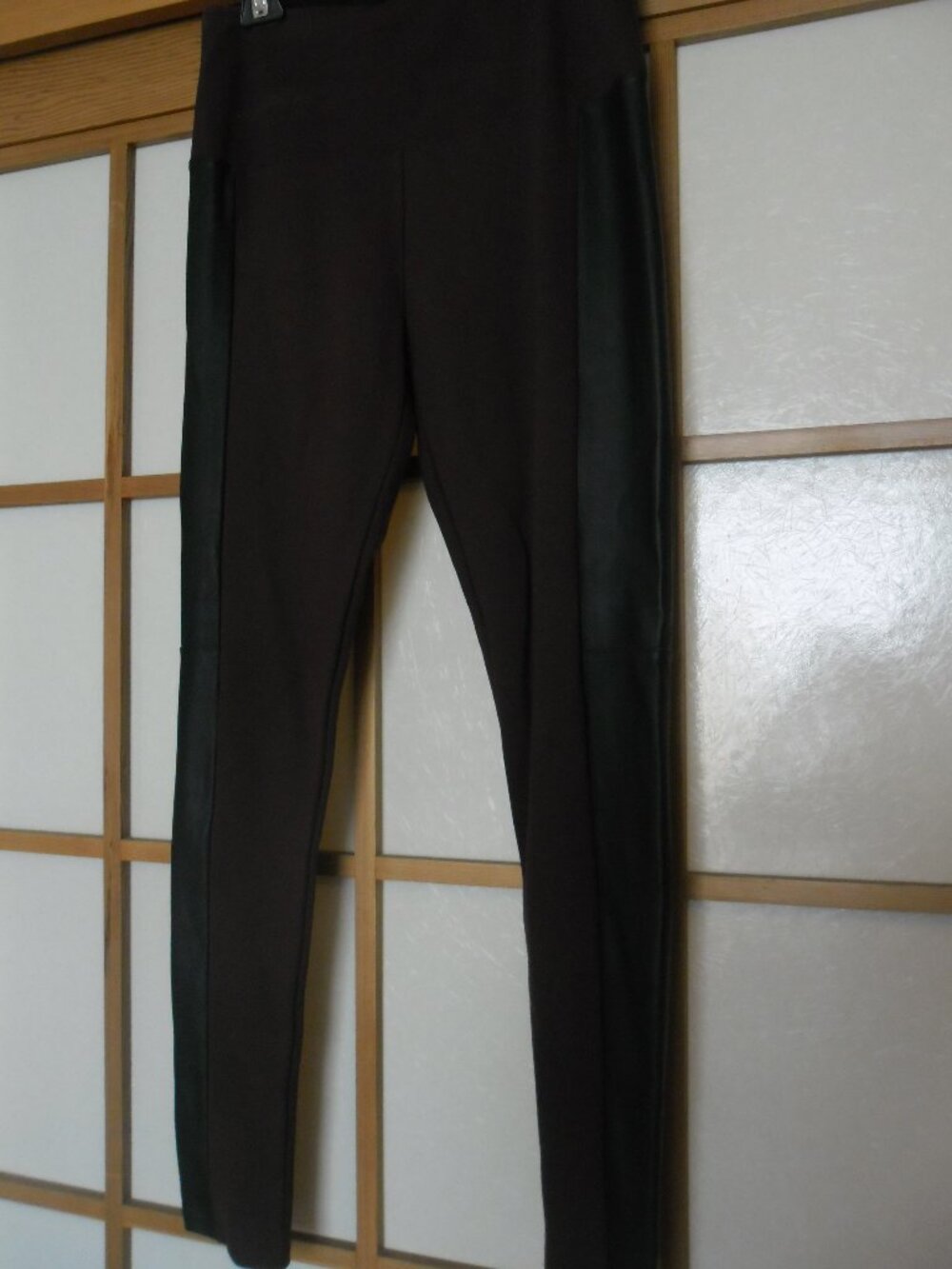Sml-medium sized athleisure wear. Aubergine colour with black leather-look sides